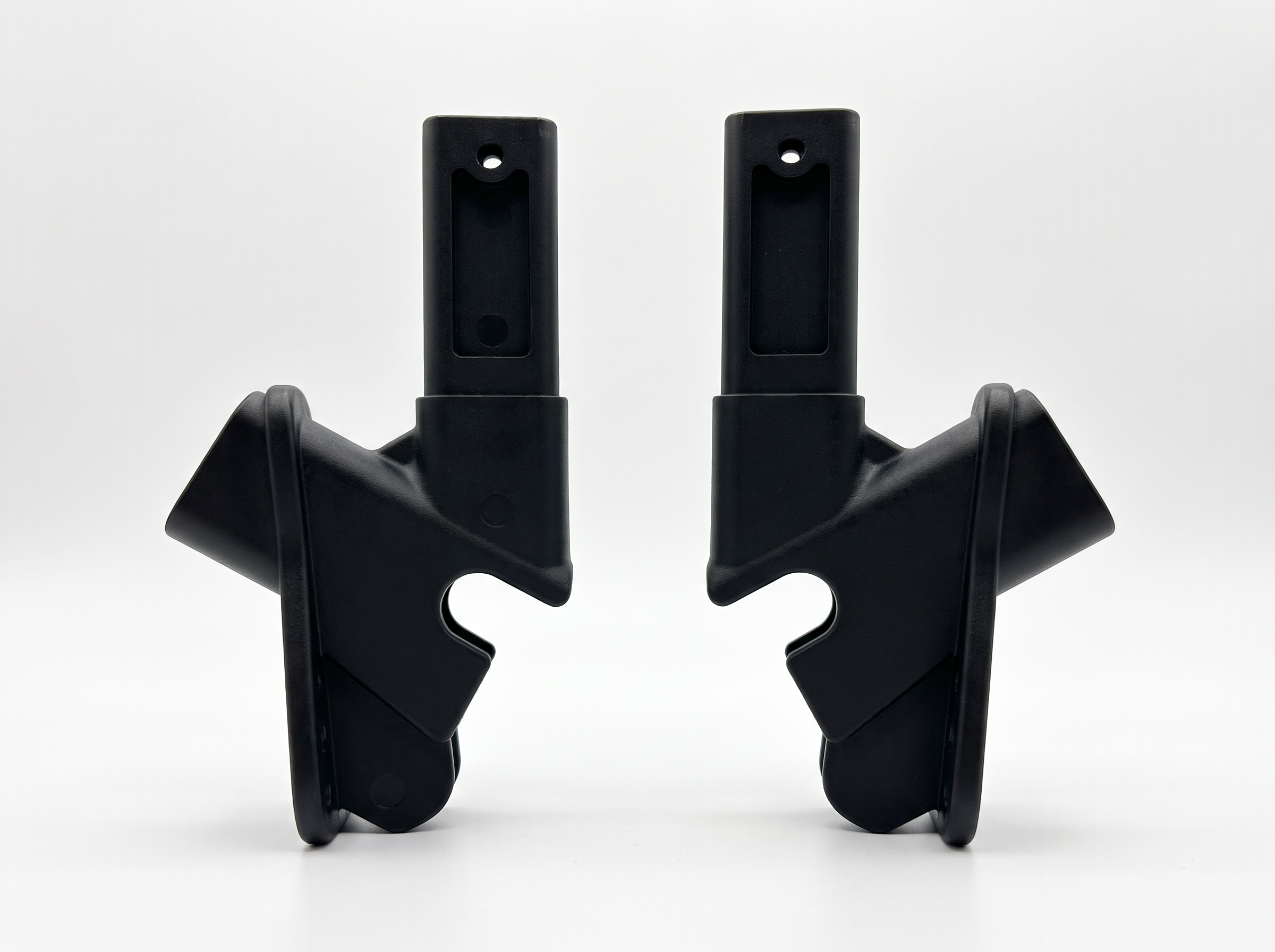 Mirrored pair of black-coated die-cast aluminium wheelchair parts